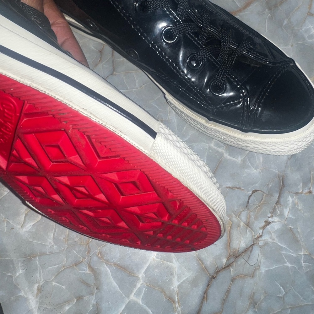 Chuck Taylor’s red bottom converse